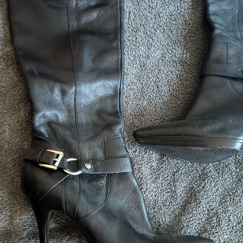 Michael Kors Boots. These are genuine cow leather a rare situation